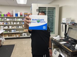 Pharmacist-helping-a-customer-at-Butterfield's-Compounding-Pharmacy-and-Medical-Supplies.