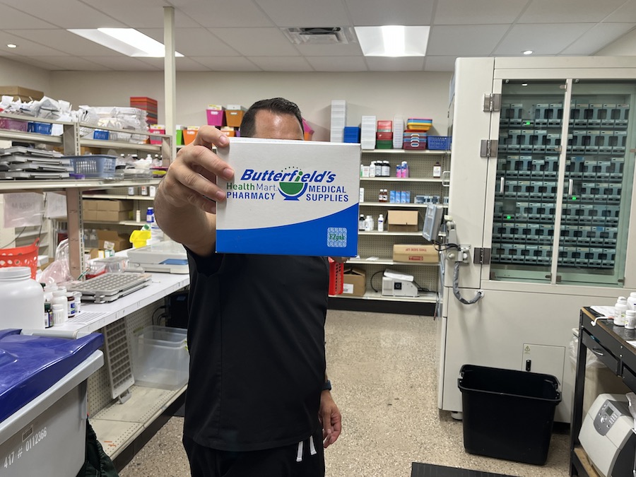 Pharmacist holding EZpak medication system
